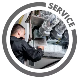 A man servicing an air conditioning unit. A man servicing an air conditioning unit.
