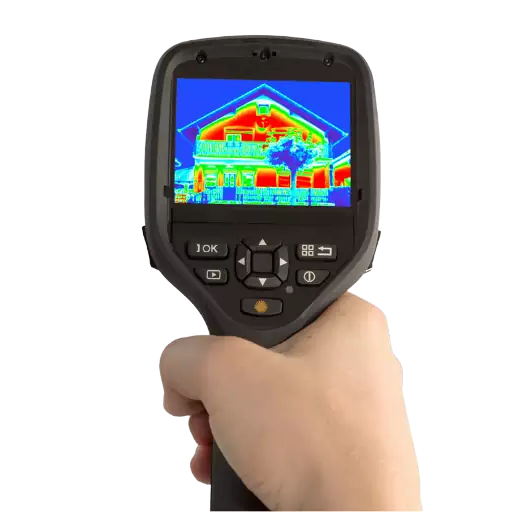 A hand holding an infrared camera for thermal imaging of a house.